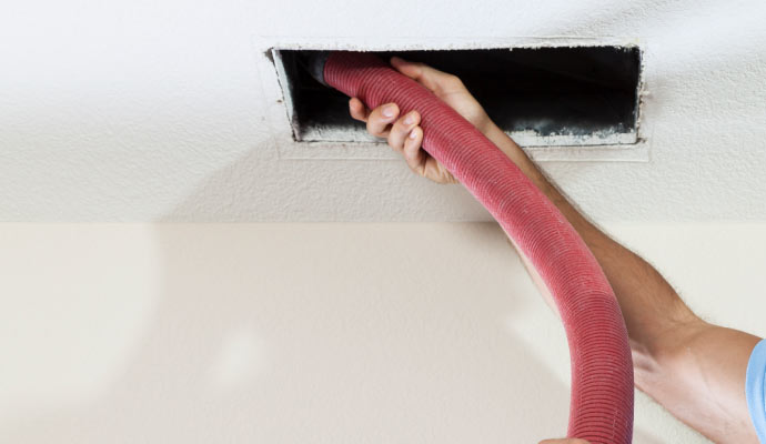 A cleaning brush inside an air duct