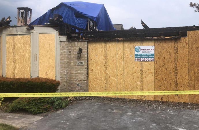 Boarded-up house after fire damage