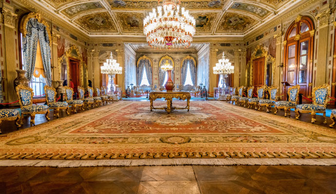 Elegant palace hall showcasing a large antique rug