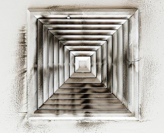 Air duct with visible layers of dust Air duct showing visible layers of dust buildup inside, indicating need for cleaning