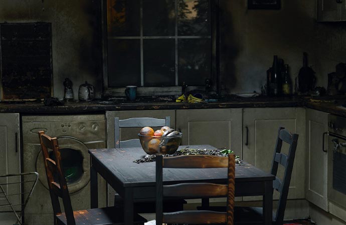 an indoor scene of a fire damaged kitchen