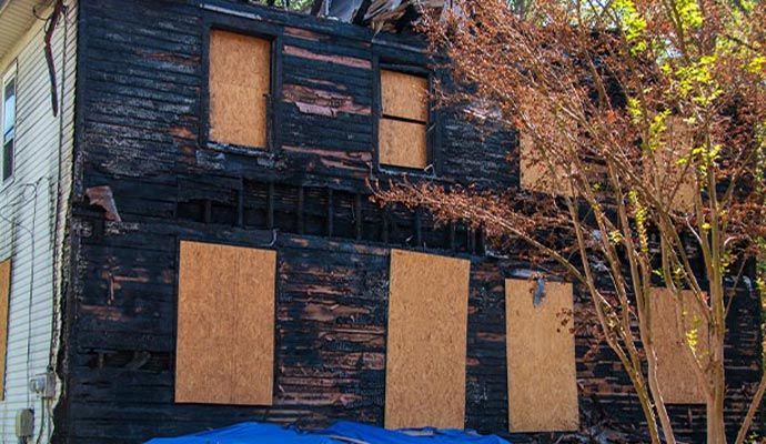 Fire damaged house board up service Fire damaged house board up service