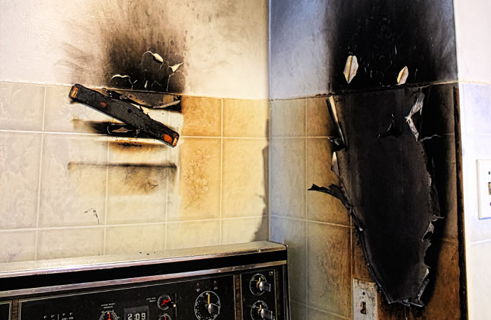 A kitchen damaged by fire