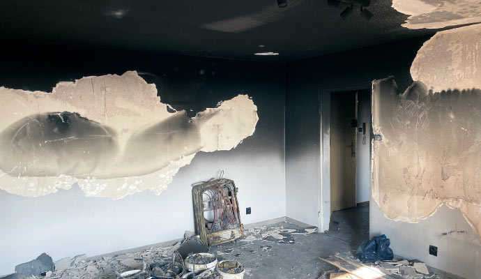 A room and ceiling damaged by fire