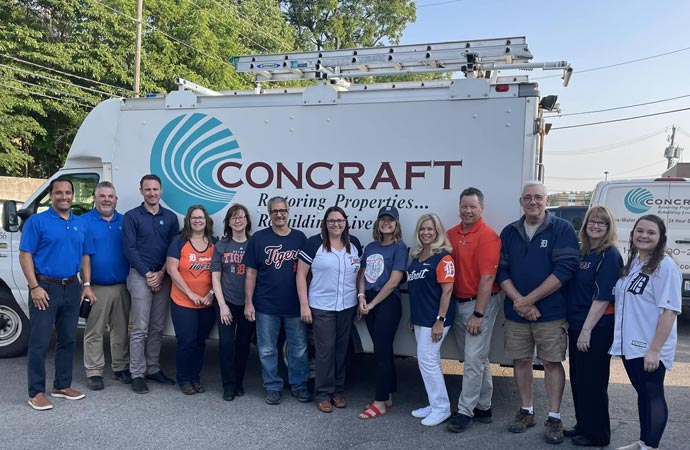 concratf team standing infront a concraft van