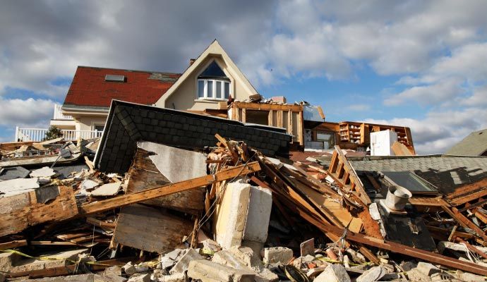 Hurricane-damaged residential property Residential property severely damaged by hurricane