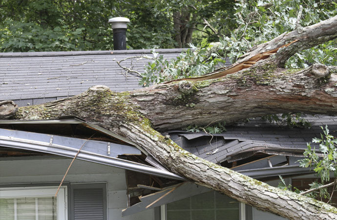 a house damaged by the aftermath of a storm